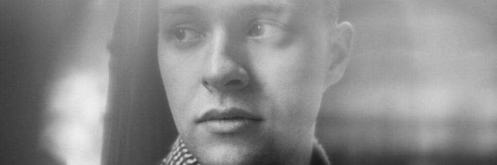 one person shown, the dominant colour of the image is grey