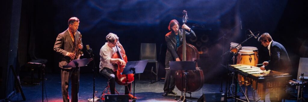 three people with dominant blue tones