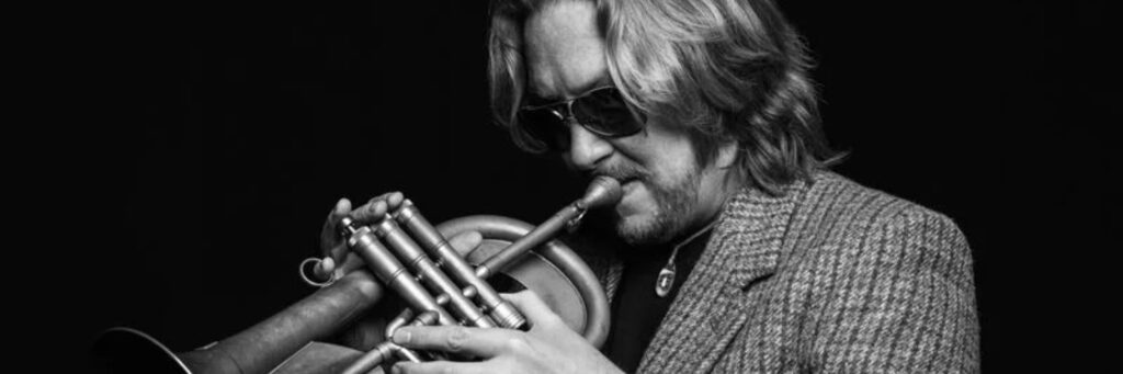 One soloist shown, with a cell phone