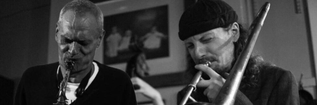 Two duo shown, with a baseball bat