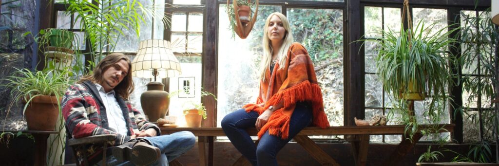 Two duo shown, indoors, with a chair