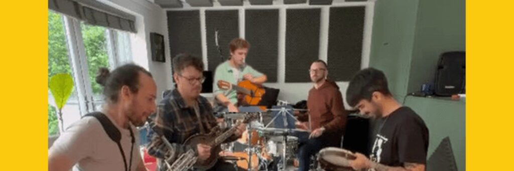 Six quintet or small group shown, indoors, with a dining table, in a group setting