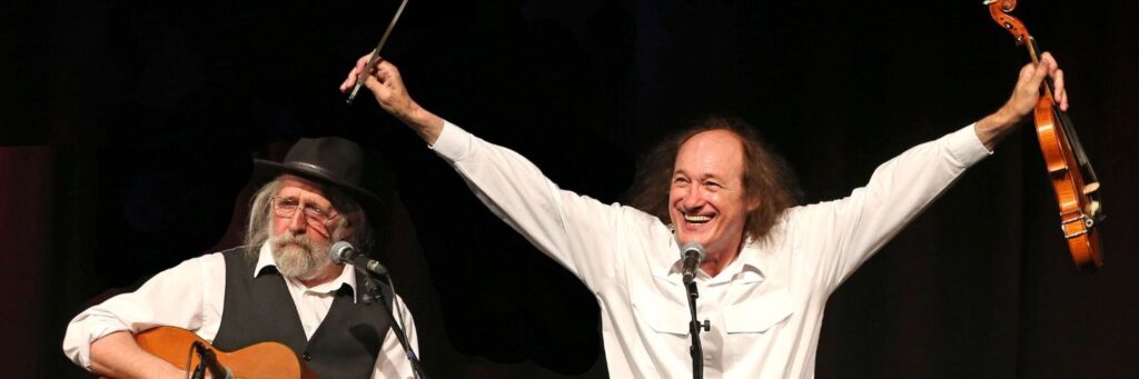 Two duo shown, with a tennis racket