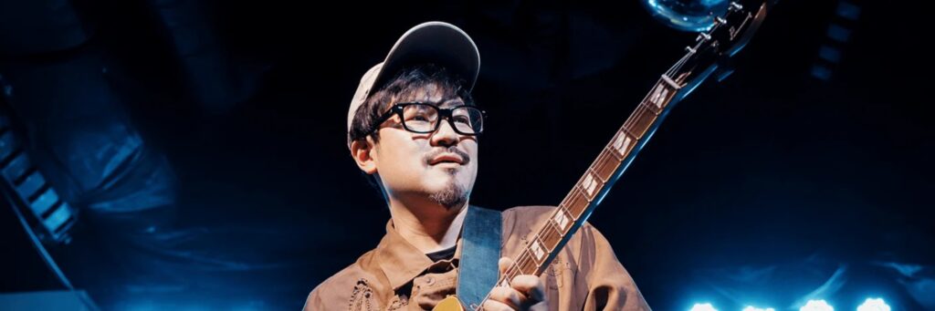 One soloist shown, with a baseball bat