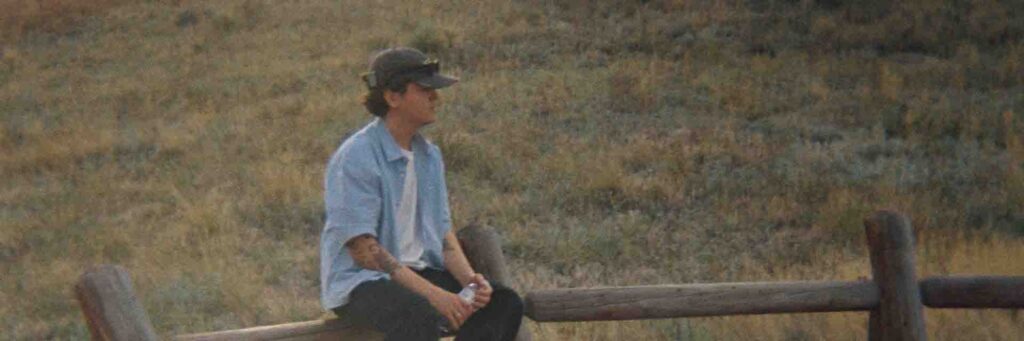One soloist shown, outdoors, with a bench
