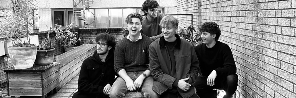 Five quintet or small group shown, with a potted plant, in a group setting