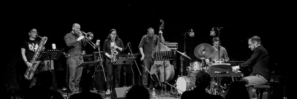 Six quintet or small group shown, in a group setting