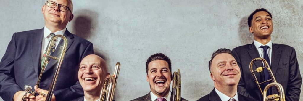 Five quintet or small group shown, with three ties, in a group setting